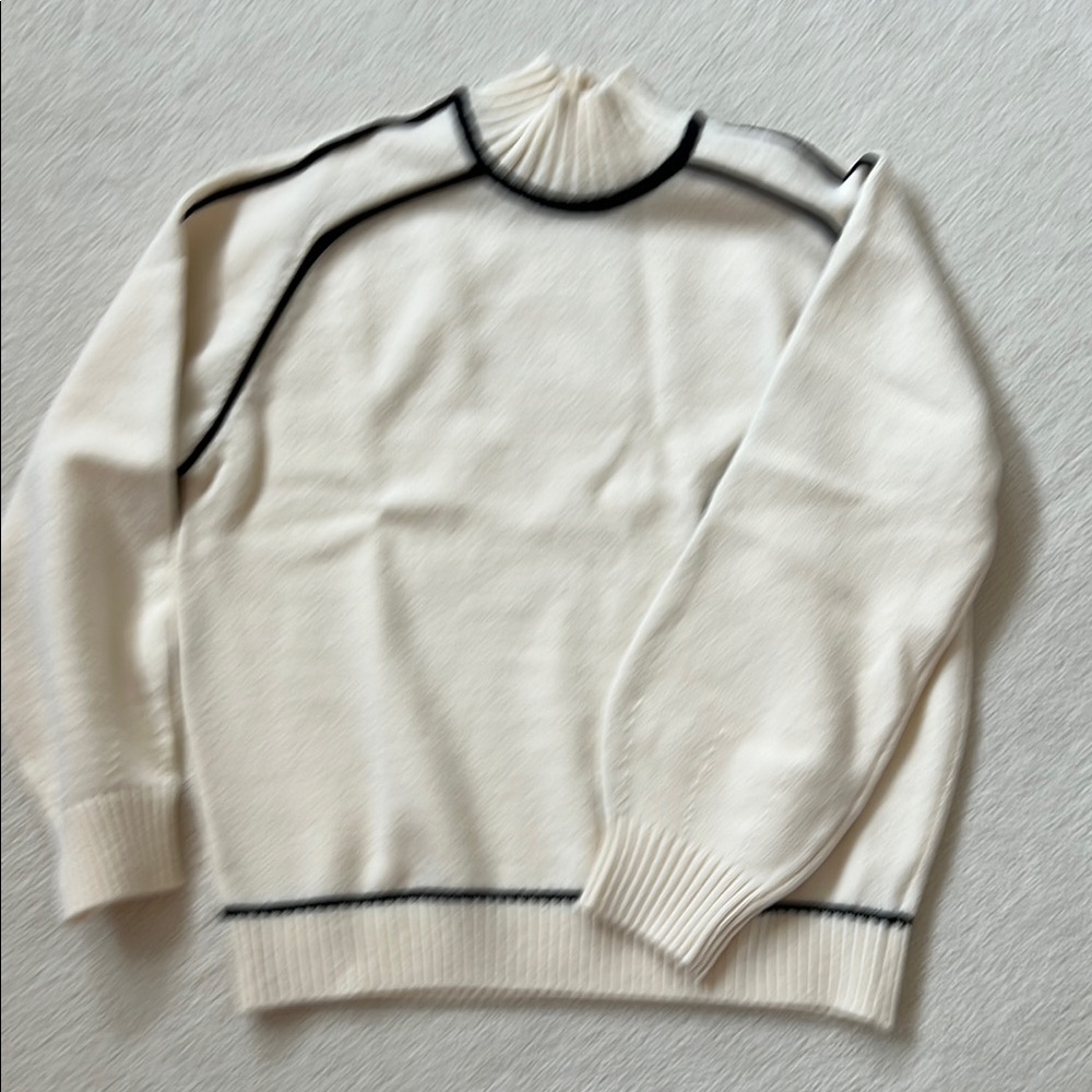 Chic Cream Sweater with Black Accents